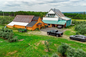 View of barn and processing building in early summer